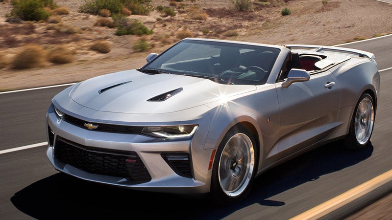 Chevrolet Camaro convertible driving on road