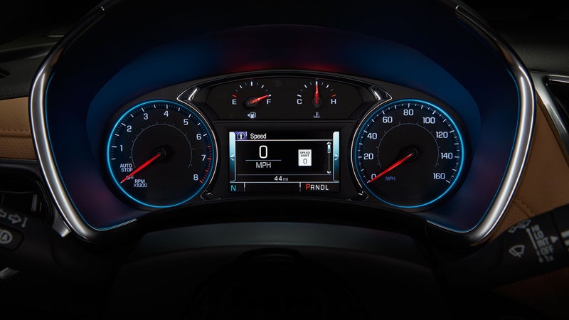 Illuminated car dashboard with speedometer, tachometer, fuel gauge, and digital display showing 0 MPH.