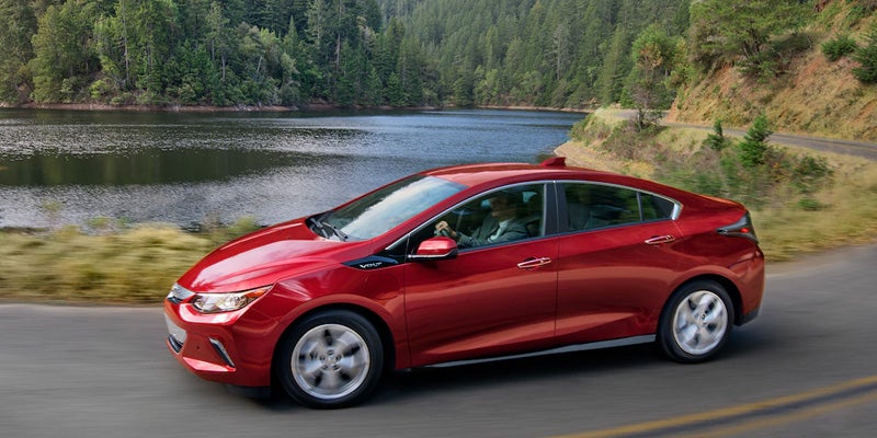 Side profile of Chevrolet Volt driving along lake