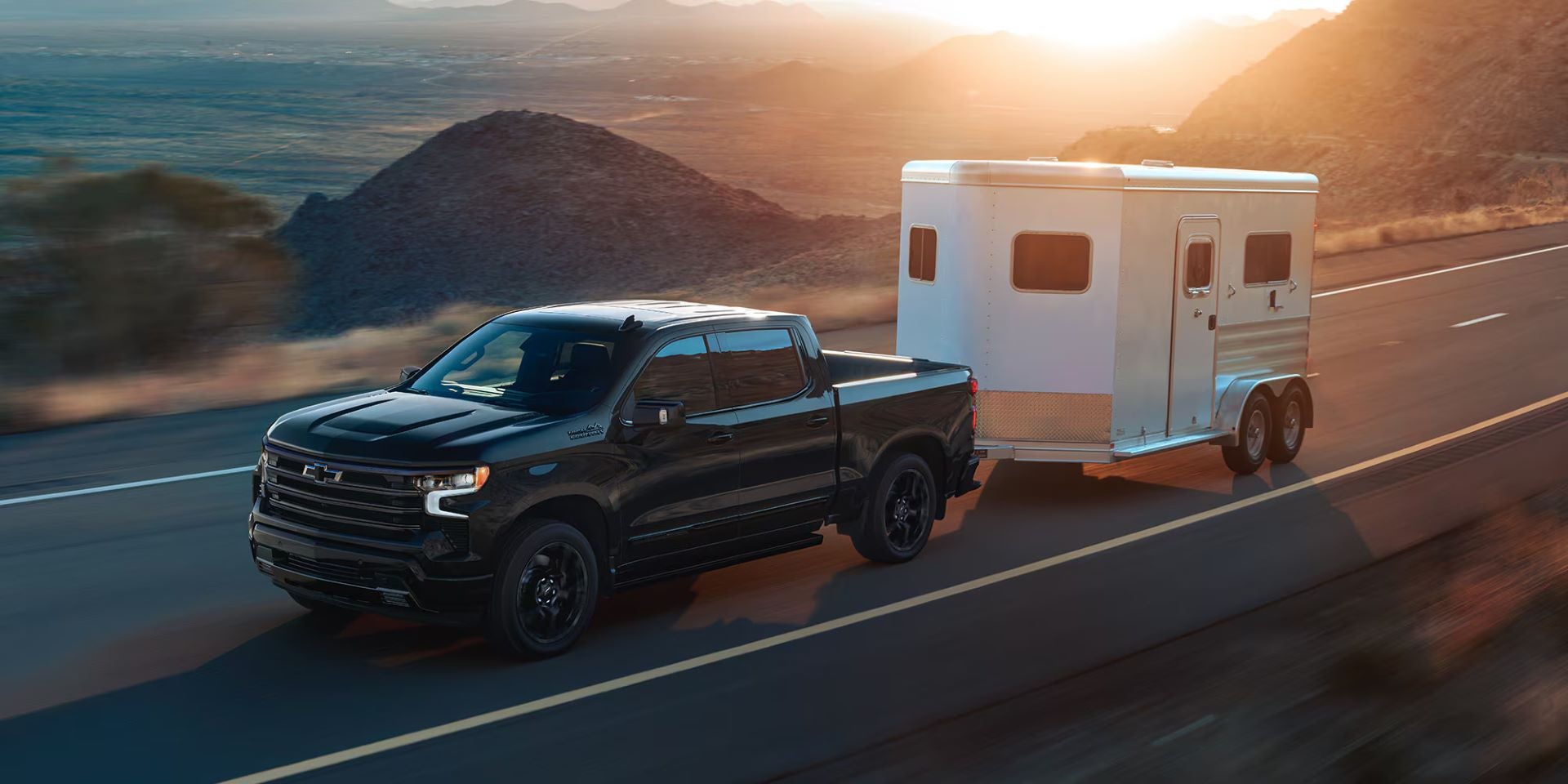Chevrolet Silverado pickup truck towing a trailer