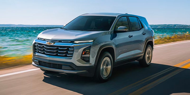 Chevrolet Traverse driving along coastal road