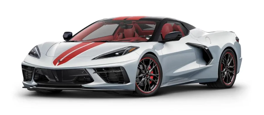 White Corvette C8 with red racing stripes, black roof, red interior, and black wheels with red accents.